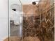 Marble tiled shower stall in the main bathroom with a view into the bedroom at 5225 Sandy Cactus Ln, Las Vegas, NV 89149