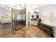 Elegant bathroom with marble shower, tub, and dual vanity at 5225 Sandy Cactus Ln, Las Vegas, NV 89149