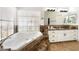 Bright main bathroom features a jacuzzi style tub with marble surround and a large window at 5225 Sandy Cactus Ln, Las Vegas, NV 89149
