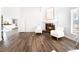 Elegant main bedroom with hardwood floors, fireplace, and white armchairs at 5225 Sandy Cactus Ln, Las Vegas, NV 89149