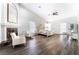 Spacious main bedroom with a fireplace, high ceilings, and hardwood floors at 5225 Sandy Cactus Ln, Las Vegas, NV 89149