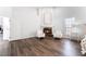 Bright main bedroom with fireplace, hardwood floors, and natural light at 5225 Sandy Cactus Ln, Las Vegas, NV 89149