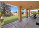Covered patio with view of landscaped backyard at 5225 Sandy Cactus Ln, Las Vegas, NV 89149