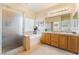 Bright bathroom with a double vanity, a large soaking tub, and a glass-enclosed shower at 532 Kavanagh Pl, Las Vegas, NV 89123