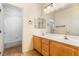 Bathroom showcasing a double sink vanity, a shower over bath and tile flooring at 532 Kavanagh Pl, Las Vegas, NV 89123
