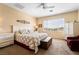Bright and spacious bedroom with carpet, ceiling fan, large window, and white furniture at 532 Kavanagh Pl, Las Vegas, NV 89123