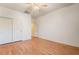 Spacious bedroom with laminate wood floor, ceiling fan, closet, and interior view at 532 Kavanagh Pl, Las Vegas, NV 89123