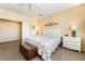 Bright bedroom with carpet, ceiling fan, nightstands, and a large window providing plenty of light at 532 Kavanagh Pl, Las Vegas, NV 89123