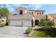 Charming two-story home with a well-manicured lawn and three-car garage at 532 Kavanagh Pl, Las Vegas, NV 89123