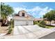 Beautiful two-story home with lush landscaping, large driveway and a three-car garage at 532 Kavanagh Pl, Las Vegas, NV 89123