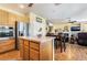 Eat-in kitchen with a center island, stainless appliances, and access to living area at 532 Kavanagh Pl, Las Vegas, NV 89123