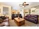Bright open-concept living space with a staircase, kitchen access and comfortable seating at 532 Kavanagh Pl, Las Vegas, NV 89123