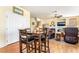 Inviting eat-in dining area flowing into a spacious living room with a fireplace at 532 Kavanagh Pl, Las Vegas, NV 89123