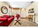 Inviting living room featuring comfortable seating, a glass table, and bright lighting at 532 Kavanagh Pl, Las Vegas, NV 89123