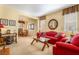 Cozy living room with neutral walls, plush carpeting and classic furniture pieces at 532 Kavanagh Pl, Las Vegas, NV 89123