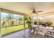 Spacious covered patio featuring a ceiling fan, outdoor furniture, grill and beautiful backyard at 532 Kavanagh Pl, Las Vegas, NV 89123