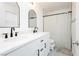 Stylish bathroom featuring dual sinks, modern fixtures, and a shower-tub combo at 551 Swiss Cottage Ave, Las Vegas, NV 89178