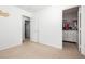 Bright bedroom featuring a walk-in closet, neutral walls, and plush carpeting at 551 Swiss Cottage Ave, Las Vegas, NV 89178