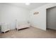 Bedroom with white walls and a matching crib and dresser set at 551 Swiss Cottage Ave, Las Vegas, NV 89178