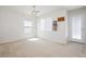 Neutral bonus room with lots of natural light, light fixture, and an exterior door at 551 Swiss Cottage Ave, Las Vegas, NV 89178