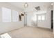 Bright bonus room with carpeted floor, many windows, and a view of the staircase at 551 Swiss Cottage Ave, Las Vegas, NV 89178
