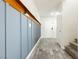Charming entryway featuring wood-look tile flooring, shiplap accent wall, and a white front door at 551 Swiss Cottage Ave, Las Vegas, NV 89178