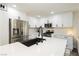 Close-up of the kitchen with stainless steel appliances and black hardware at 551 Swiss Cottage Ave, Las Vegas, NV 89178