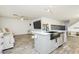 Open kitchen with an island, stainless steel appliances, and view to the living area at 551 Swiss Cottage Ave, Las Vegas, NV 89178