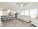 Bright, open-concept kitchen featuring an island with barstool seating, stainless steel appliances, and modern finishes at 551 Swiss Cottage Ave, Las Vegas, NV 89178