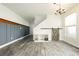 Spacious living room featuring modern furnishings, wood-look flooring, and ample natural light at 551 Swiss Cottage Ave, Las Vegas, NV 89178