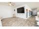 Open-concept living room featuring a media center, stylish seating, and convenient barstool seating at 551 Swiss Cottage Ave, Las Vegas, NV 89178