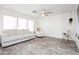 Bright living room with a comfortable sofa, modern ceiling fan, and lots of natural light at 551 Swiss Cottage Ave, Las Vegas, NV 89178
