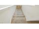 Carpeted stairs lead to the upper level of the home at 551 Swiss Cottage Ave, Las Vegas, NV 89178