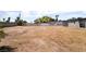 Spacious backyard featuring a sturdy perimeter fence and a blank canvas for landscaping and outdoor activities at 5617 Alfred Dr, Las Vegas, NV 89108