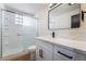 Updated bathroom featuring a glass enclosed shower, sleek fixtures, and modern vanity at 5617 Alfred Dr, Las Vegas, NV 89108
