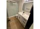 Bathroom featuring modern vanity with marble countertop and a glass shower enclosure at 5617 Alfred Dr, Las Vegas, NV 89108