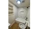 Modern bathroom with a shower-tub combo, hexagon accent tile, and built in shelving at 5617 Alfred Dr, Las Vegas, NV 89108