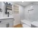 Bathroom with new vanity, shelving and luxurious shower featuring marble-like tile at 5617 Alfred Dr, Las Vegas, NV 89108