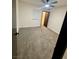 Bedroom featuring neutral carpet, ceiling fan, and a window providing natural light at 5617 Alfred Dr, Las Vegas, NV 89108