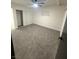 Bedroom featuring neutral carpet, ceiling fan, and a sliding closet doors at 5617 Alfred Dr, Las Vegas, NV 89108