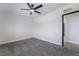 Bright bedroom with modern ceiling fan, carpet, and contemporary door frames at 5617 Alfred Dr, Las Vegas, NV 89108