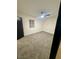 Bedroom featuring neutral carpet, ceiling fan, and a window providing natural light at 5617 Alfred Dr, Las Vegas, NV 89108