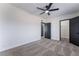 Bedroom featuring carpet, ceiling fan, and modern door frames at 5617 Alfred Dr, Las Vegas, NV 89108