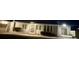 Well-maintained one-story house with a tidy front yard at night at 5617 Alfred Dr, Las Vegas, NV 89108
