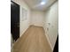 Hallway with wood-look floors and laundry hookups at 5617 Alfred Dr, Las Vegas, NV 89108