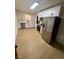 Well lit and spacious kitchen featuring stainless steel appliances, white cabinets, and modern appliances at 5617 Alfred Dr, Las Vegas, NV 89108