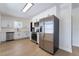 Modern kitchen with stainless steel appliances, quartz countertops, and stylish white cabinets at 5617 Alfred Dr, Las Vegas, NV 89108