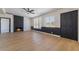 Bright living room with wood floors, fireplace, and large windows at 5617 Alfred Dr, Las Vegas, NV 89108