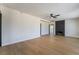 Spacious living room featuring wood flooring and a cozy fireplace at 5617 Alfred Dr, Las Vegas, NV 89108
