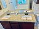 Bathroom with a double sink vanity and a separate bathtub at 6043 Cape Clairmont Ct, North Las Vegas, NV 89031